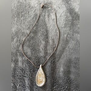 2/$20 Pottery pendant on adjustable braided shoelace necklace.